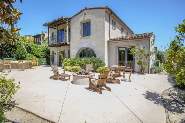 a kitchen with stainless steel appliances granite countertop wooden floors and sink