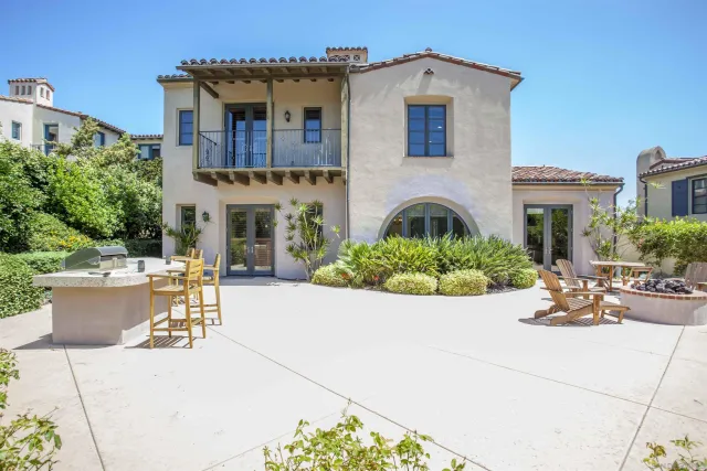 a kitchen with granite countertop a refrigerator and a stove
