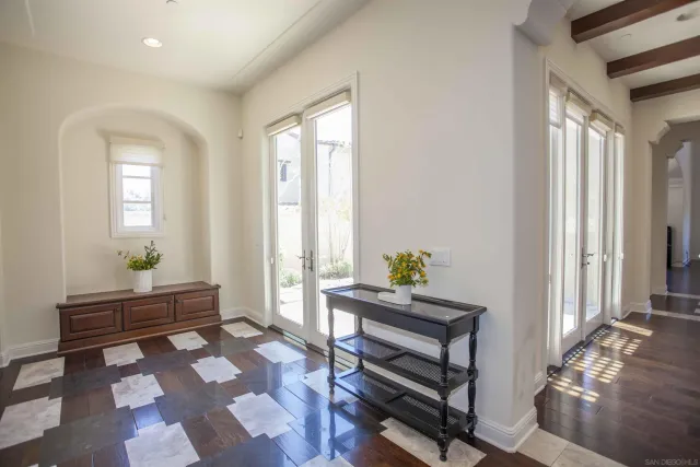 a kitchen with stainless steel appliances granite countertop wooden floor and center island