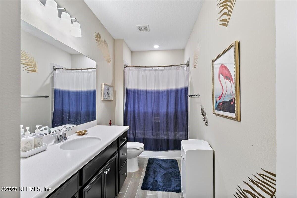2393 Reese Way Jacksonville, FL 32246 - Photo 14 of 30 a bathroom with a sink a toilet and shower