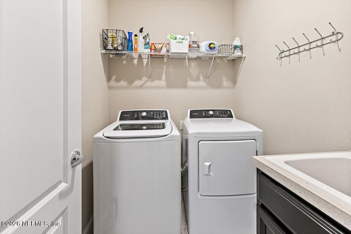 2393 Reese Way Jacksonville, FL 32246 - Photo 16 of 30 a utility room with dryer and washer