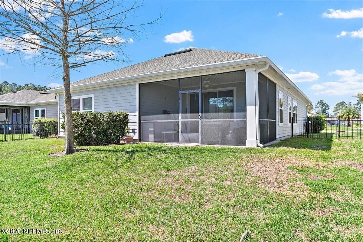2393 Reese Way Jacksonville, FL 32246 - Photo 18 of 30 a front view of a house with a yard