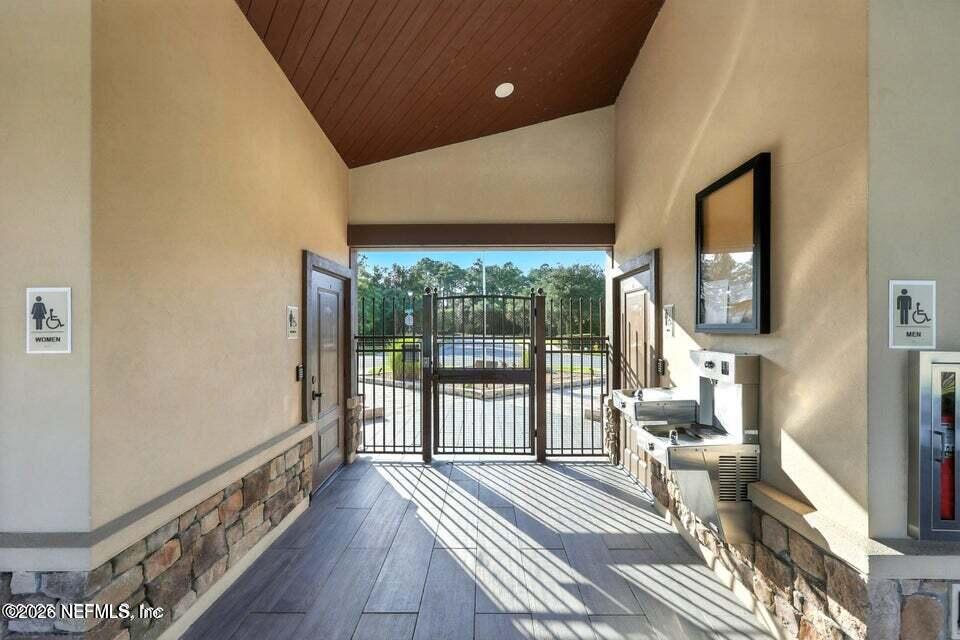 2393 Reese Way Jacksonville, FL 32246 - Photo 22 of 30 a view of a room with wooden floor and windows