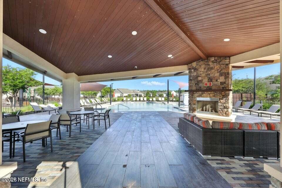 2393 Reese Way Jacksonville, FL 32246 - Photo 23 of 30 a view of a dining hall with furniture window and wooden floor