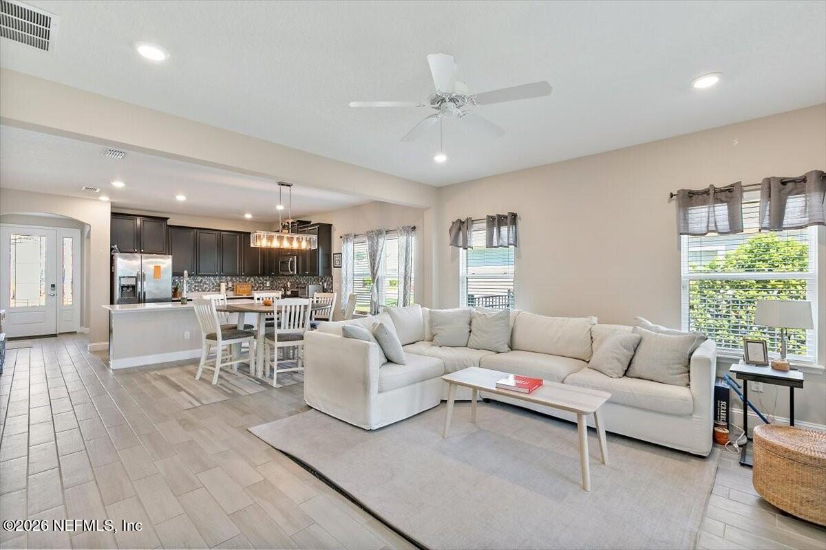 2393 Reese Way Jacksonville, FL 32246 - Photo 5 of 30 a living room with furniture and a large window