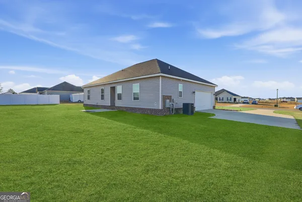 a view of a house with a big yard