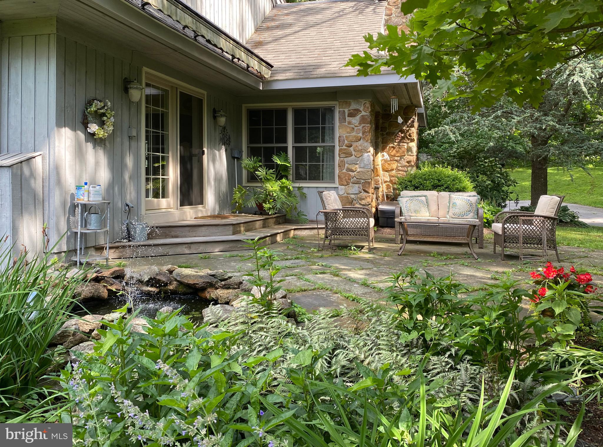 1451 Hilltop Road Spring City, PA 19475 - Photo 51 of 99 Flagstone Deck and Fish Pond
