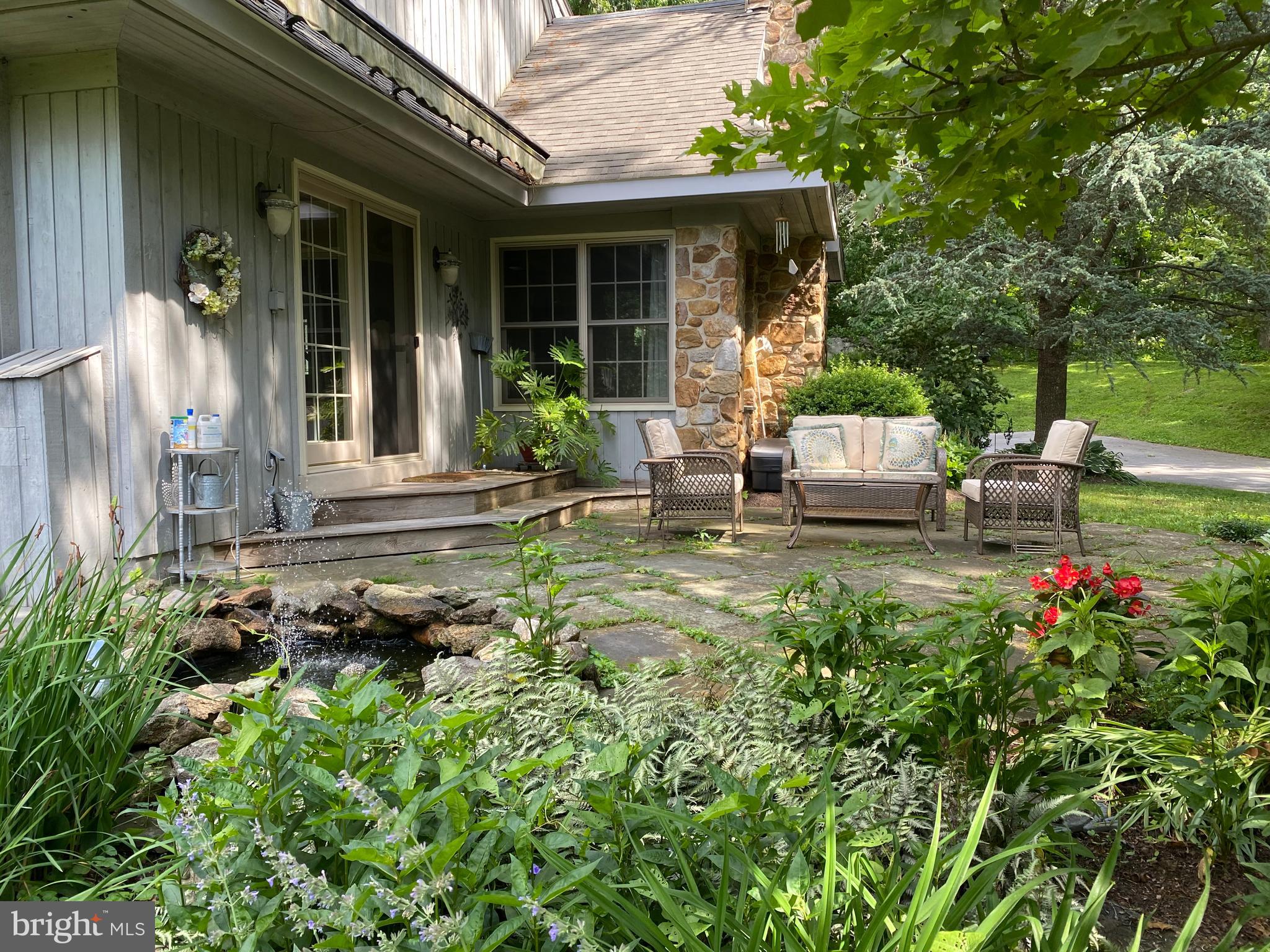 1451 Hilltop Road Spring City, PA 19475 - Photo 86 of 99 Flagstone Patio and Fish Pond