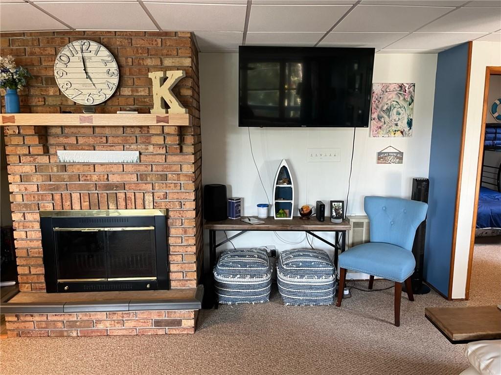 573 Lake Road Addison, PA 15411 - Photo 15 of 48 a living room with furniture a flat screen tv and a fireplace