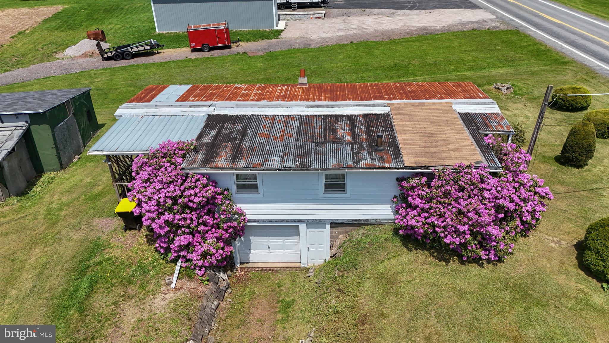 3551 Quakake Road Weatherly, PA 18255 - Photo 1 of 15 an aerial view of a house with a garden and deck