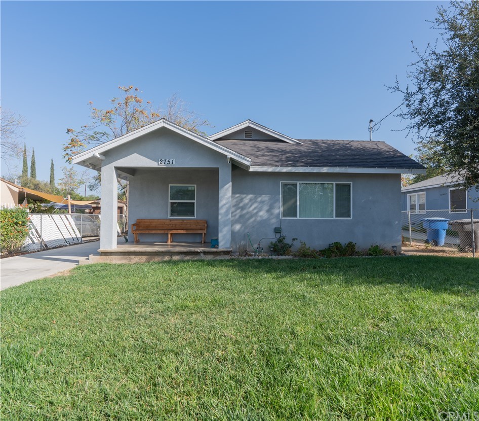 2751 Iris Street Riverside, CA 92507 - Photo 1 of 1 a backyard of a house with table and chairs