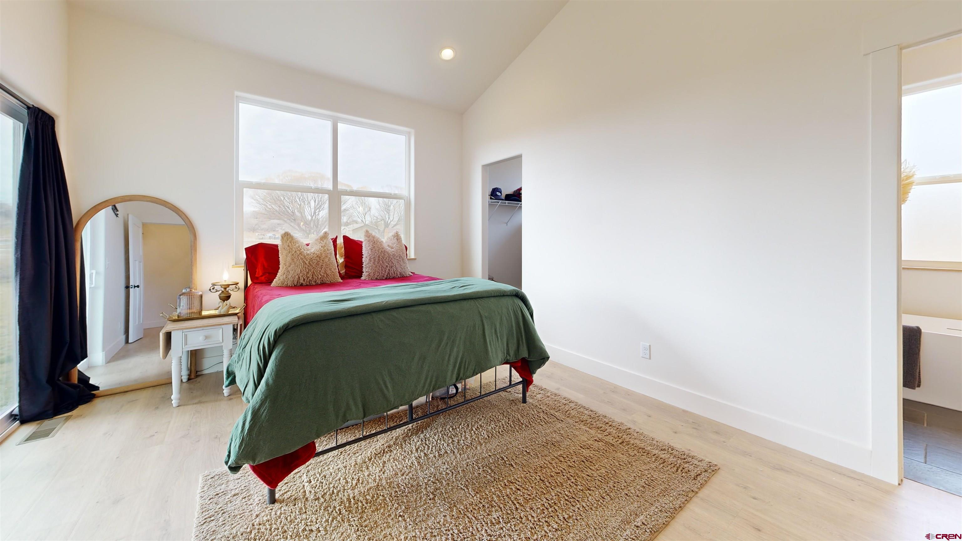 6851 Church Road Olathe, CO 81425 - Photo 13 of 27 a bedroom with a bed and a window