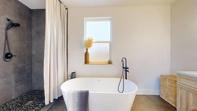 a bathroom with a sink and a window