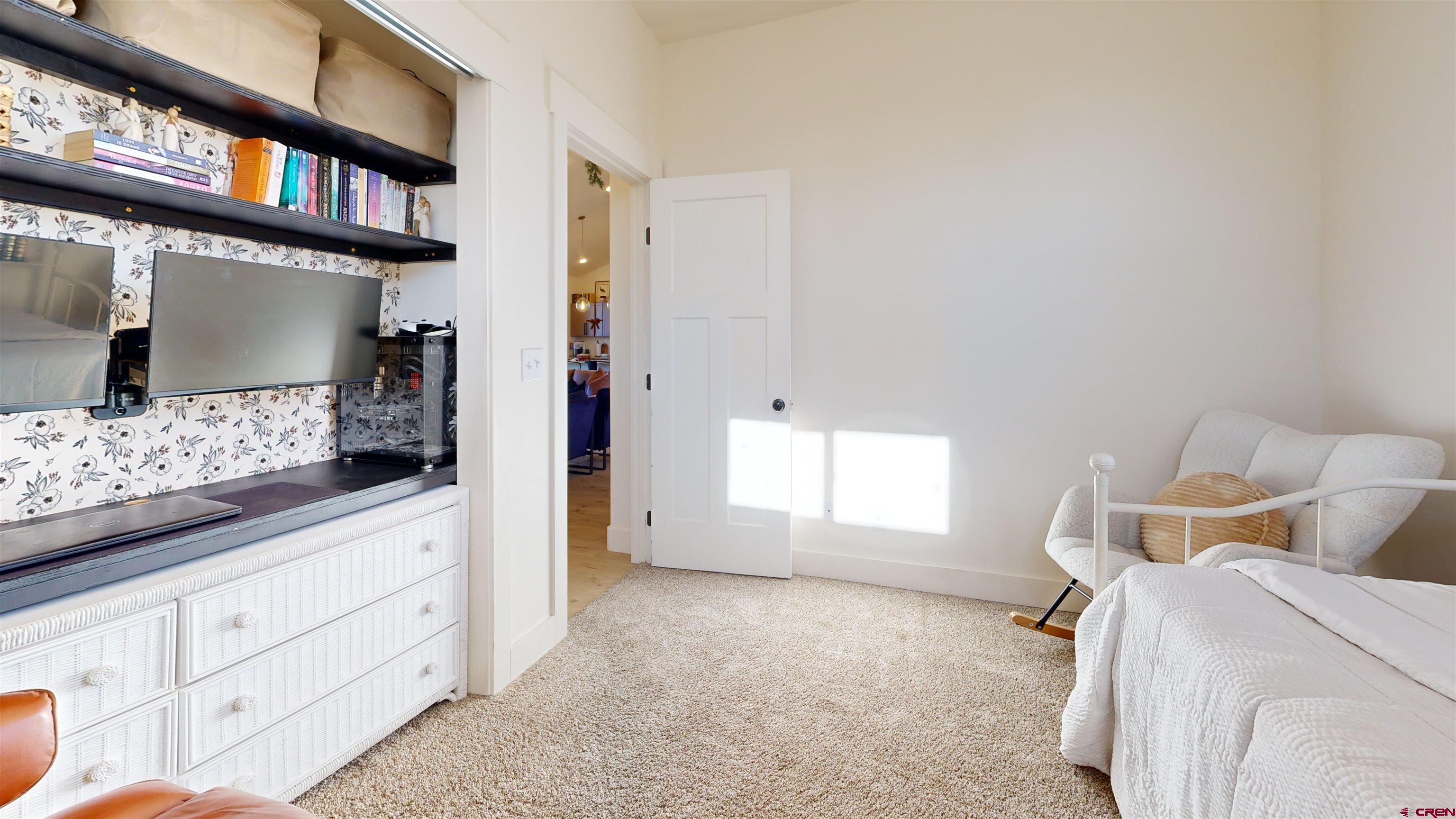 6851 Church Road Olathe, CO 81425 - Photo 21 of 27 a bedroom with a bed and a large window