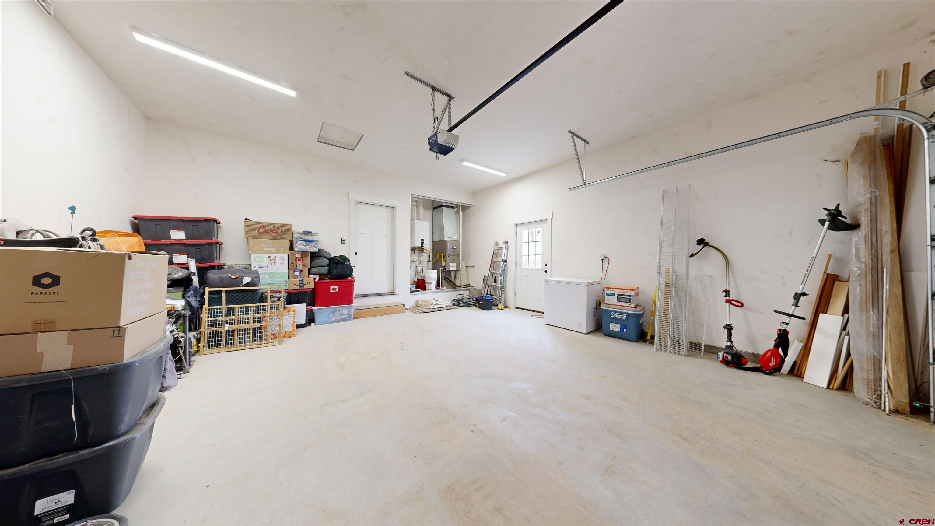 6851 Church Road Olathe, CO 81425 - Photo 27 of 27 a room with furniture and a flat screen tv