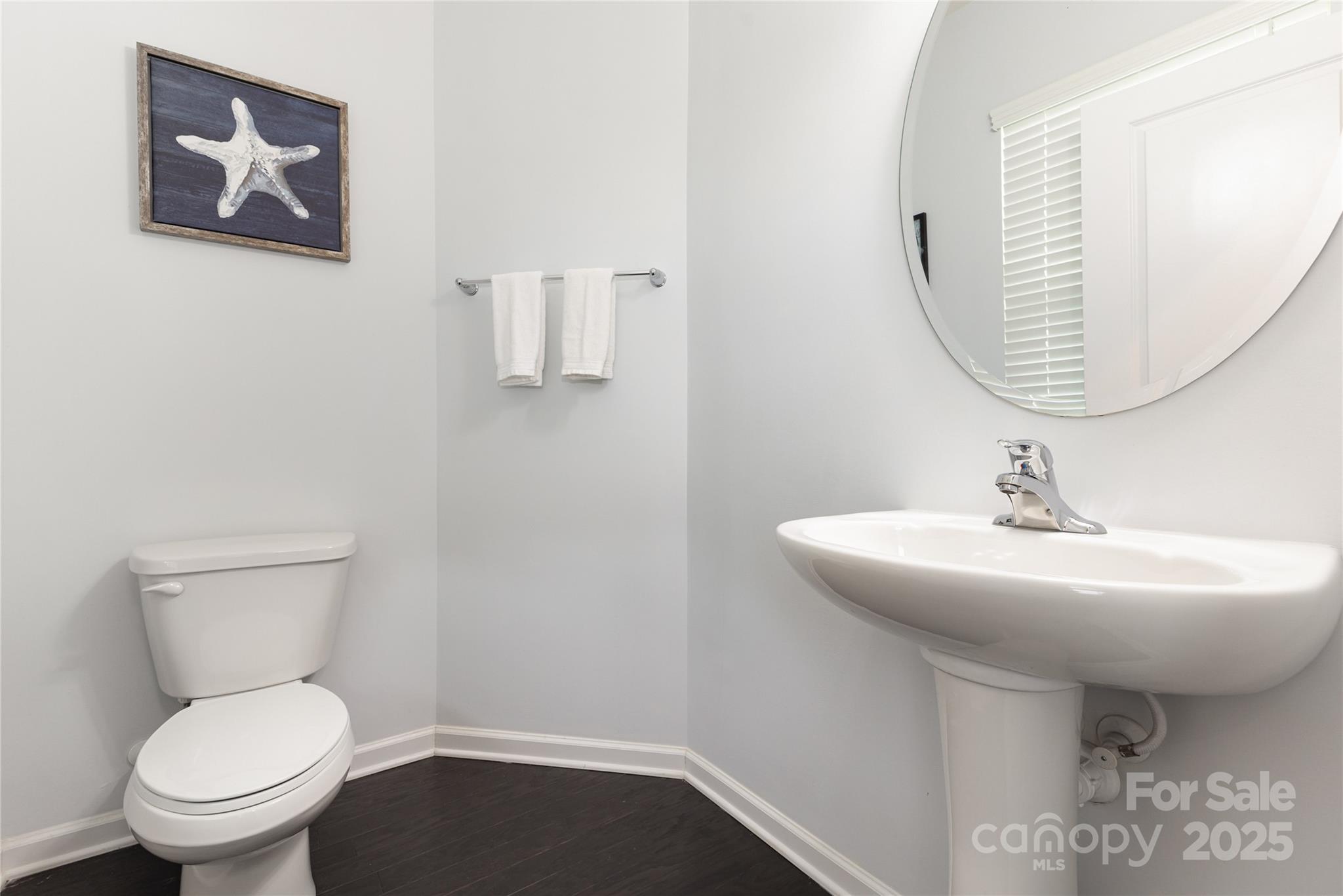717 Swift Run Tega Cay, SC 29708 - Photo 13 of 39 a bathroom with a toilet sink and mirror