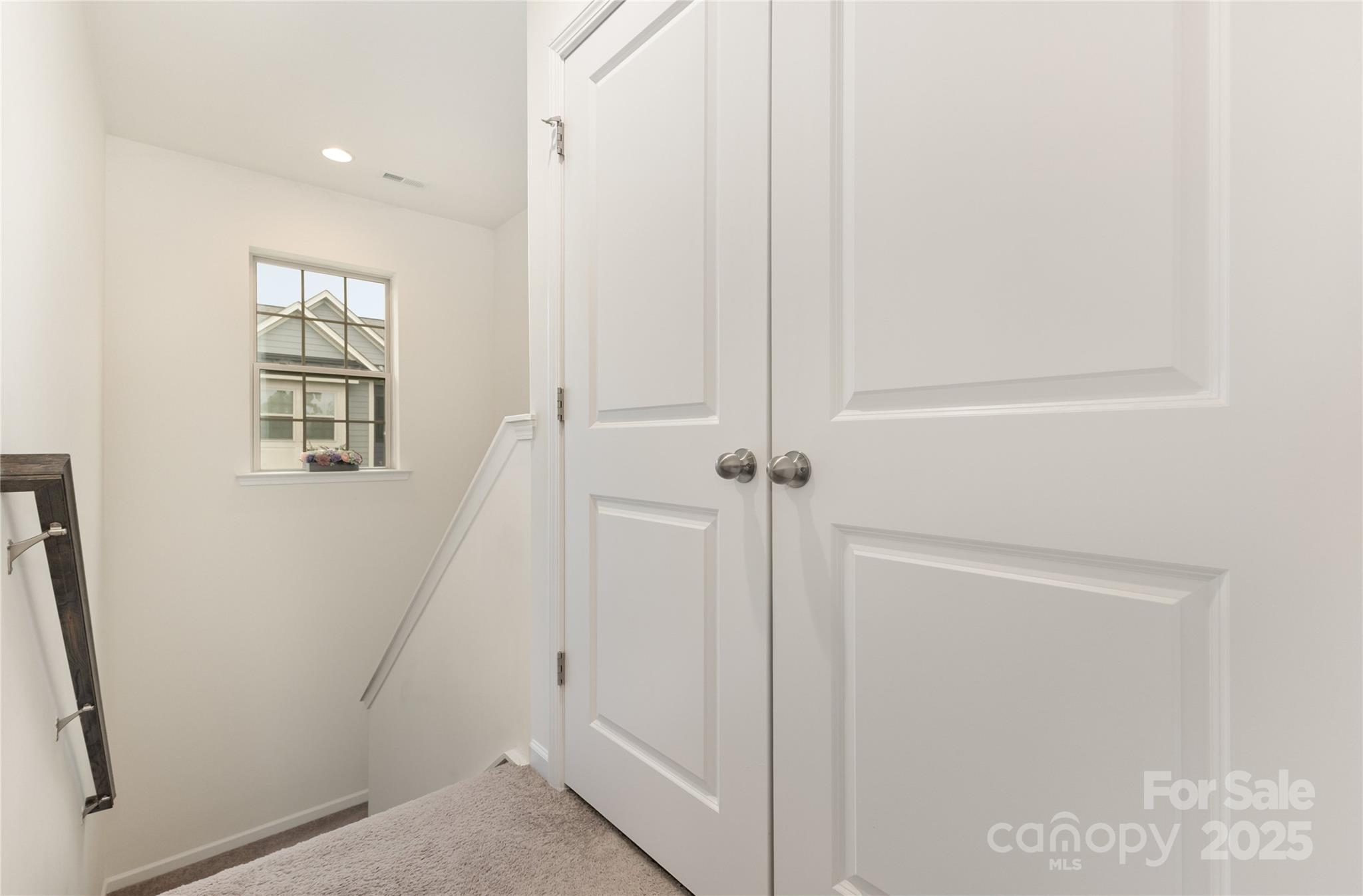 717 Swift Run Tega Cay, SC 29708 - Photo 14 of 39 a view of a hallway with windows