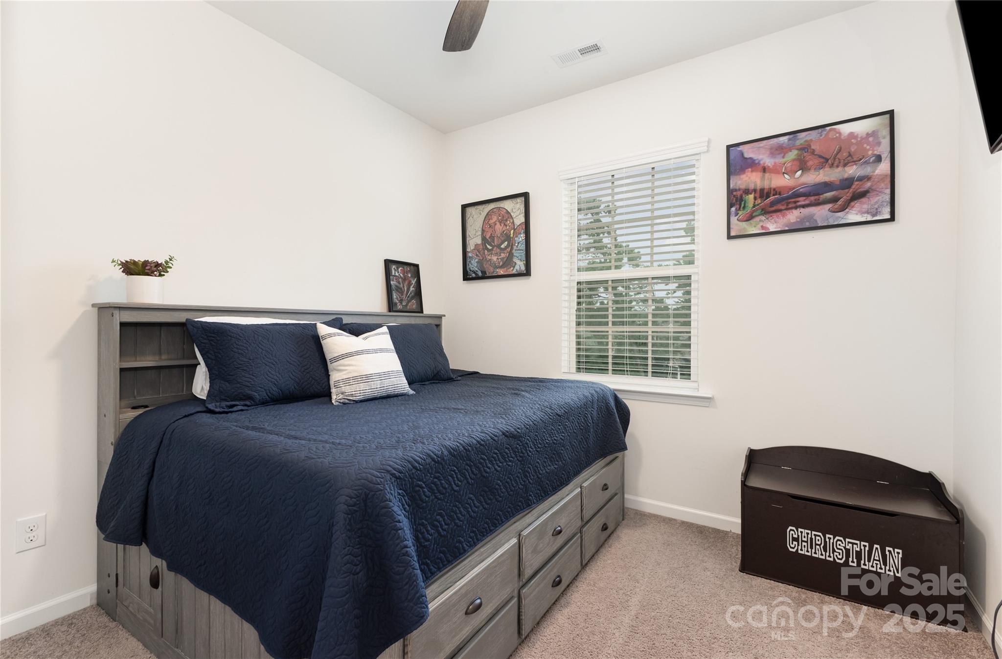 717 Swift Run Tega Cay, SC 29708 - Photo 20 of 39 a bedroom with a bed and a window