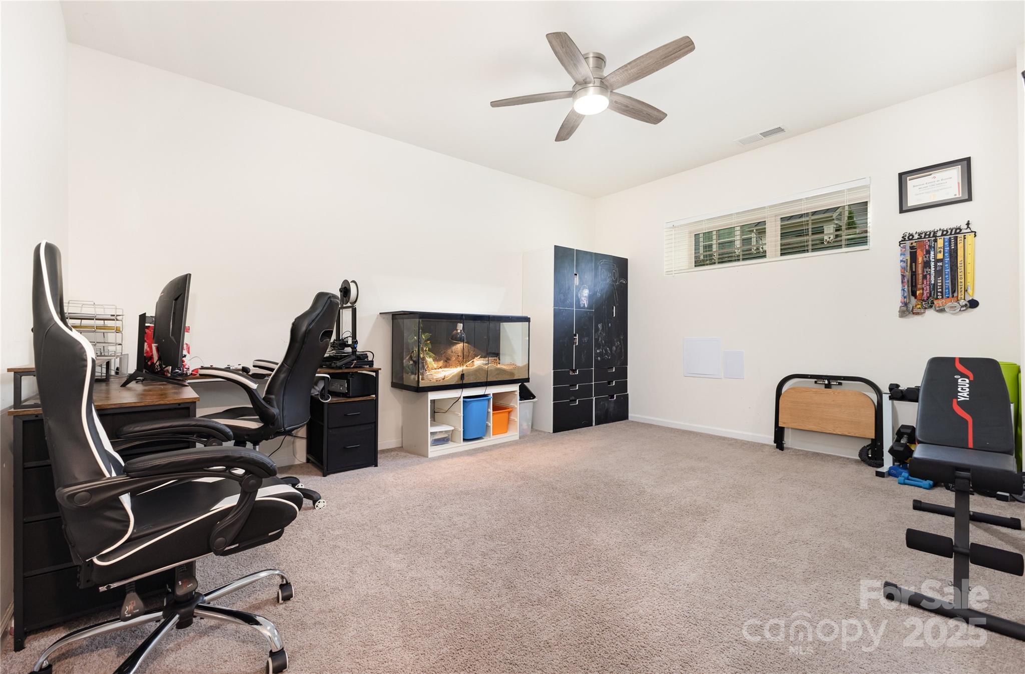 717 Swift Run Tega Cay, SC 29708 - Photo 25 of 39 a view of a workspace with furniture and a ceiling fan