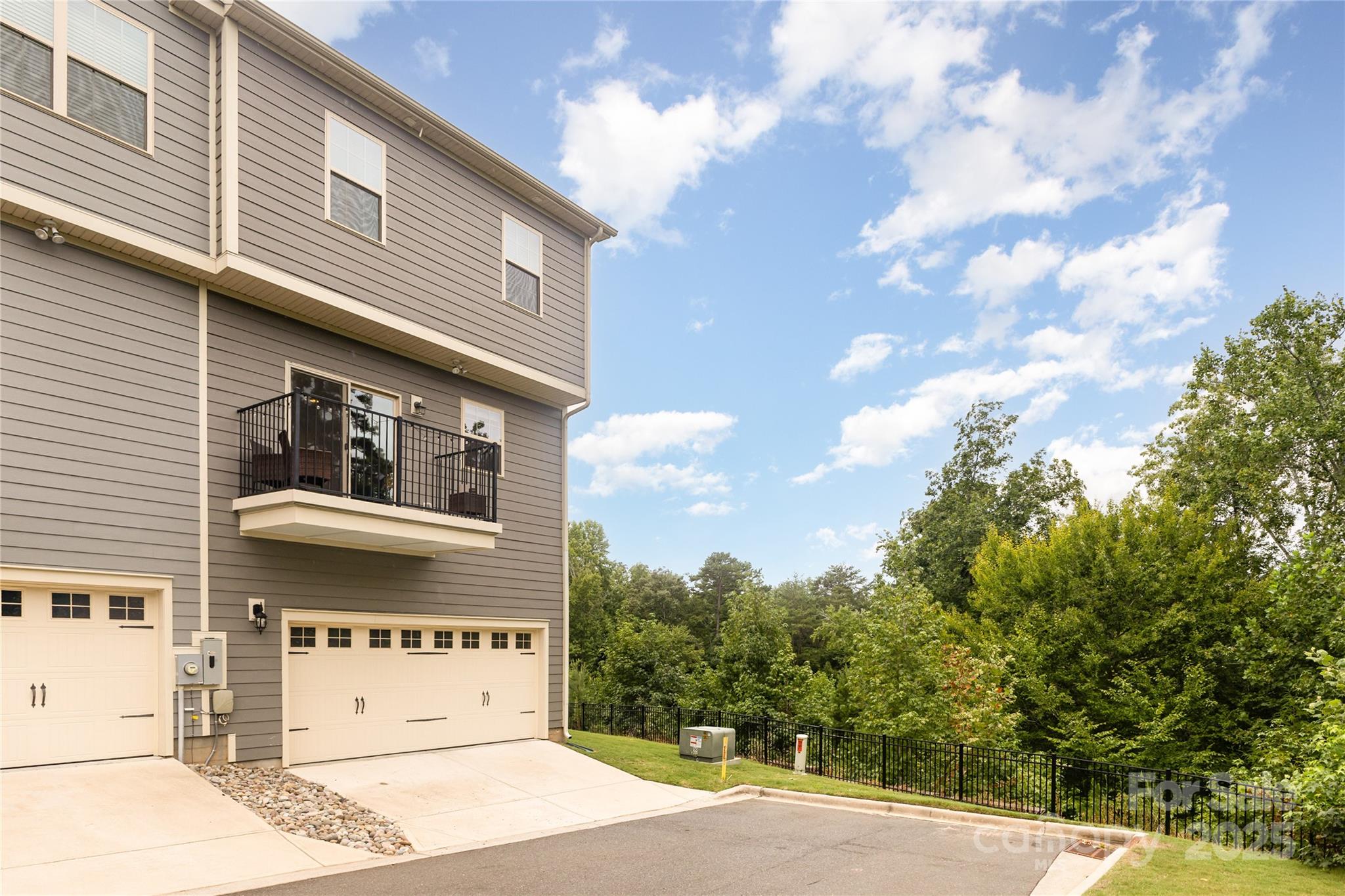 717 Swift Run Tega Cay, SC 29708 - Photo 27 of 39 a front view of a building with a yard