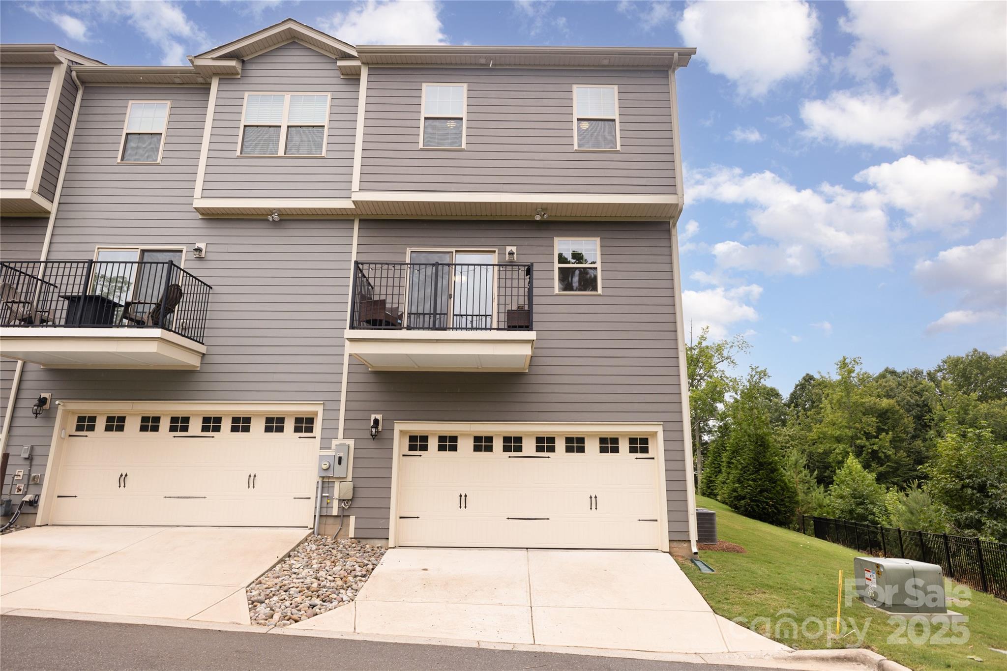 717 Swift Run Tega Cay, SC 29708 - Photo 28 of 39 a front view of a house with a garage