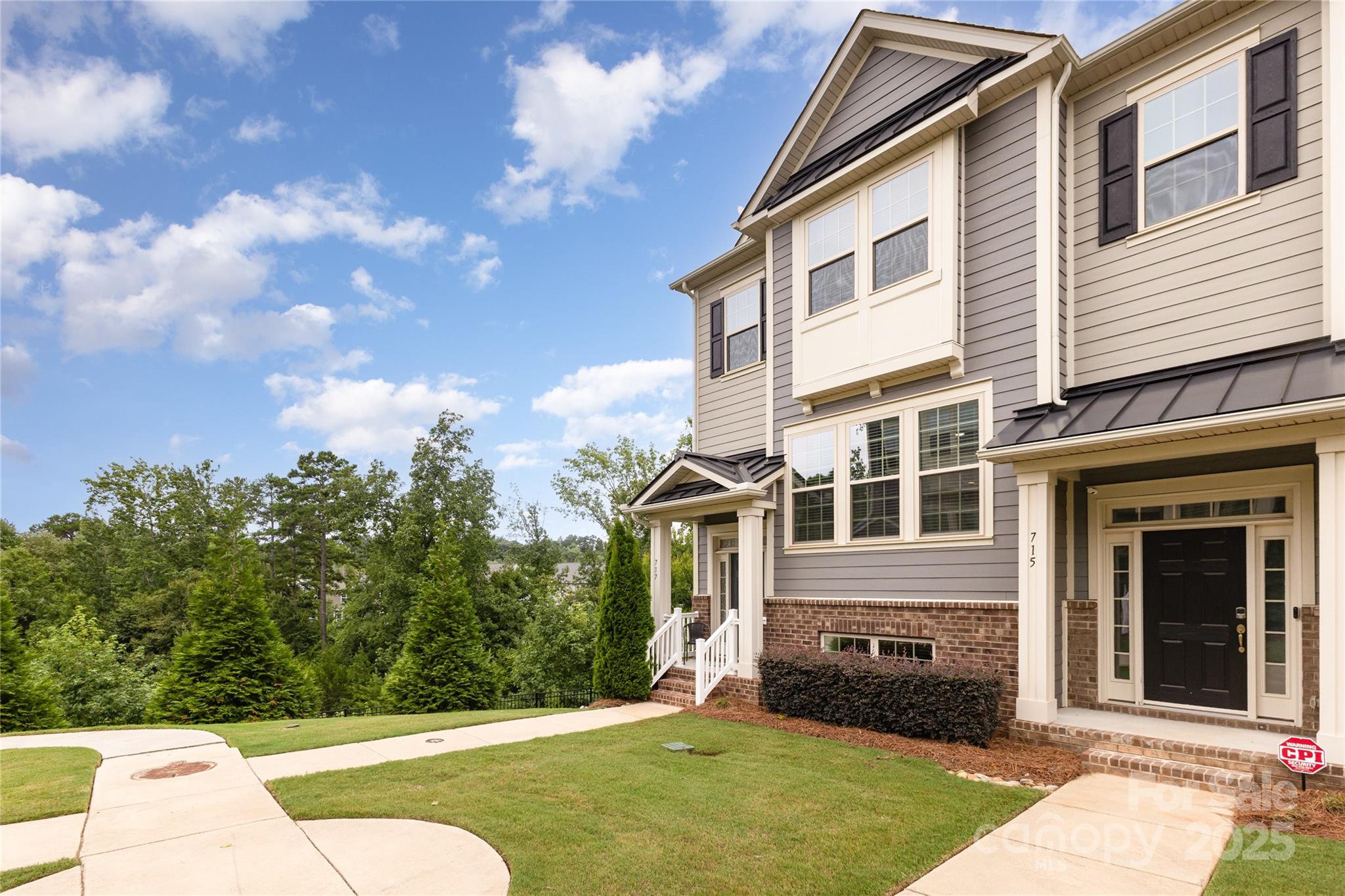 717 Swift Run Tega Cay, SC 29708 - Photo 30 of 39 a house view with a garden space