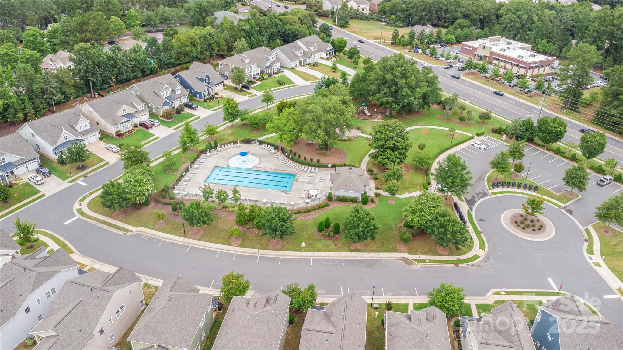 717 Swift Run Tega Cay, SC 29708 - Photo 32 of 39 an aerial view of a house with a garden and lake view