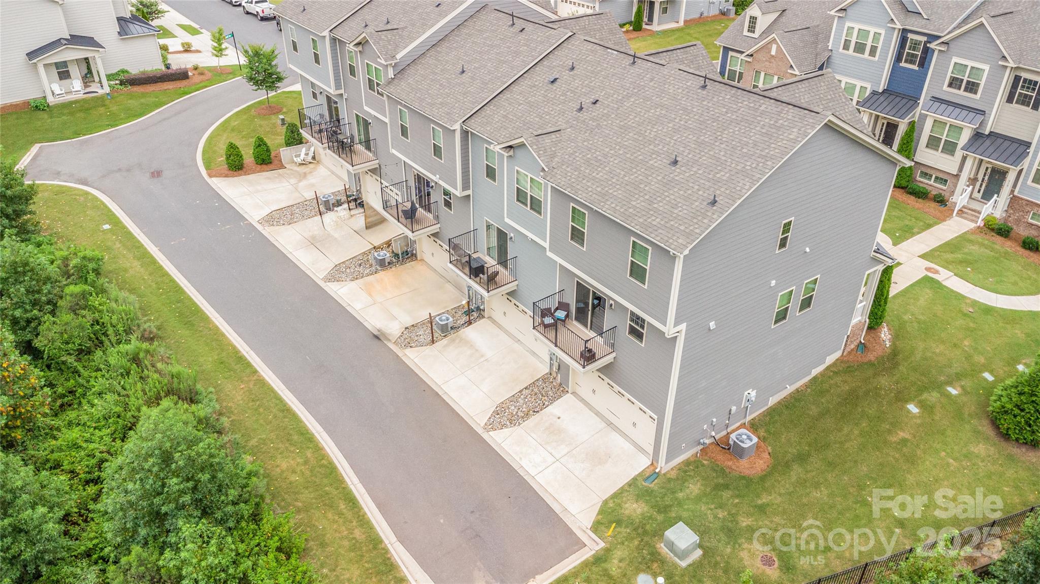 717 Swift Run Tega Cay, SC 29708 - Photo 34 of 39 a view of balcony with a yard and potted plants