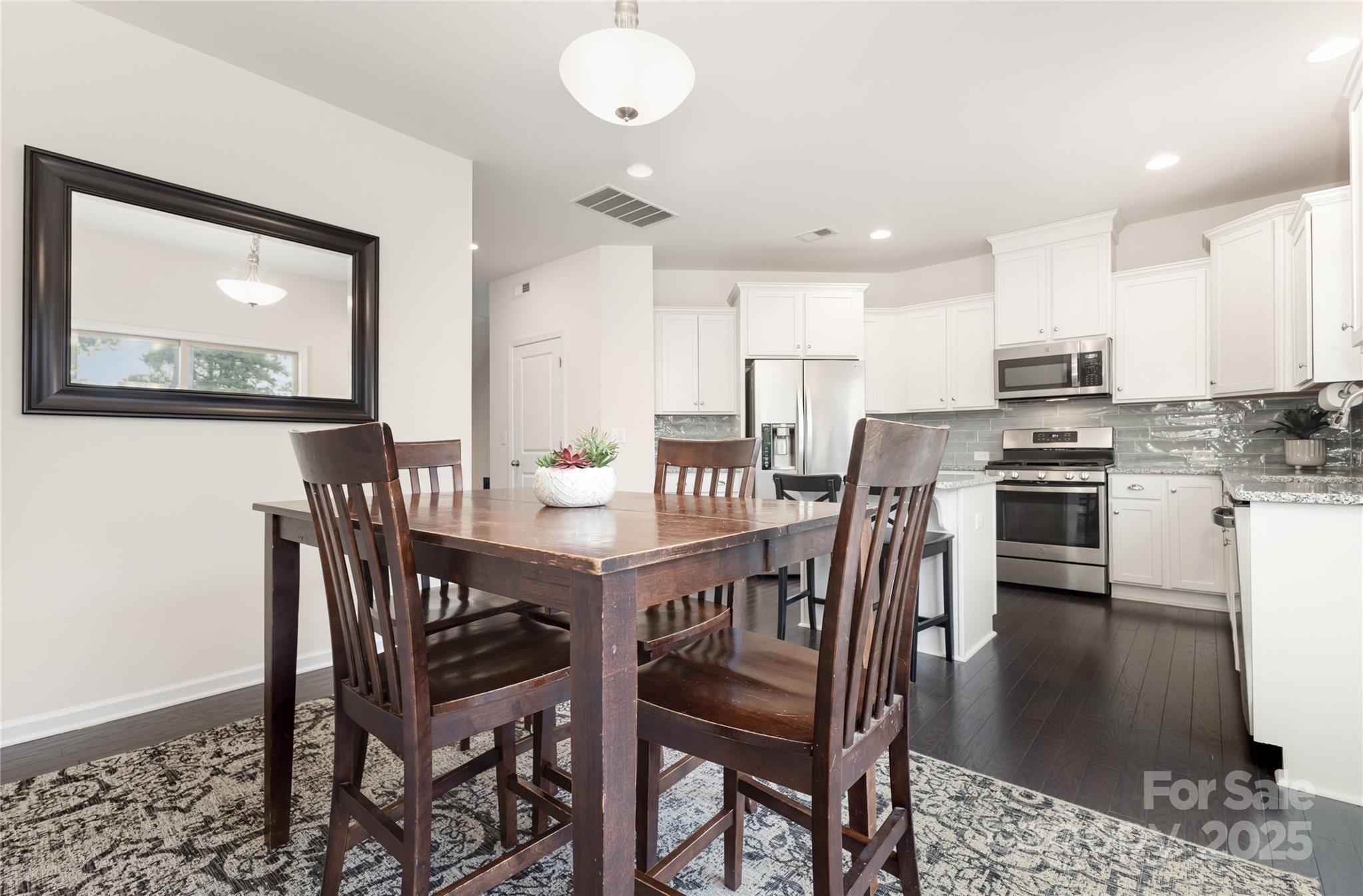 717 Swift Run Tega Cay, SC 29708 - Photo 10 of 39 a view of a dining room with furniture