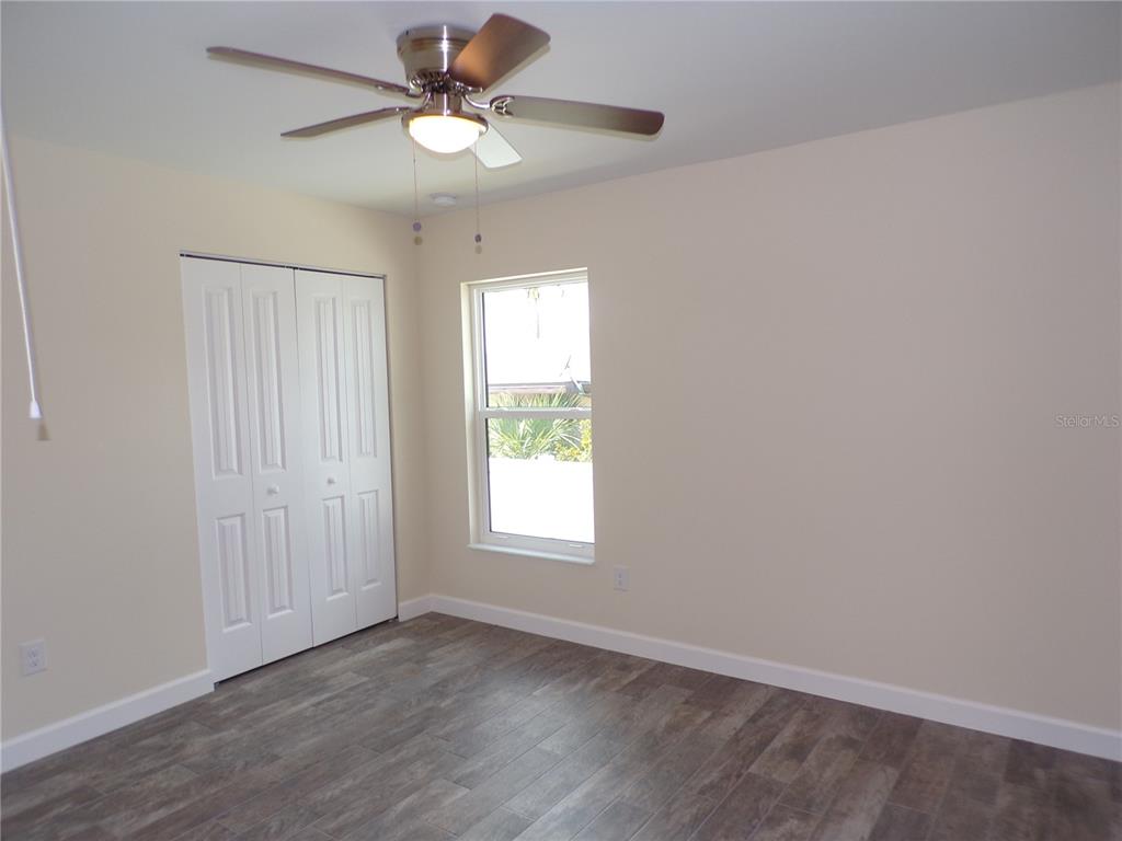 3112 Pinetree Street Port Charlotte, FL 33952 - Photo 19 of 35 a view of an empty room with a window
