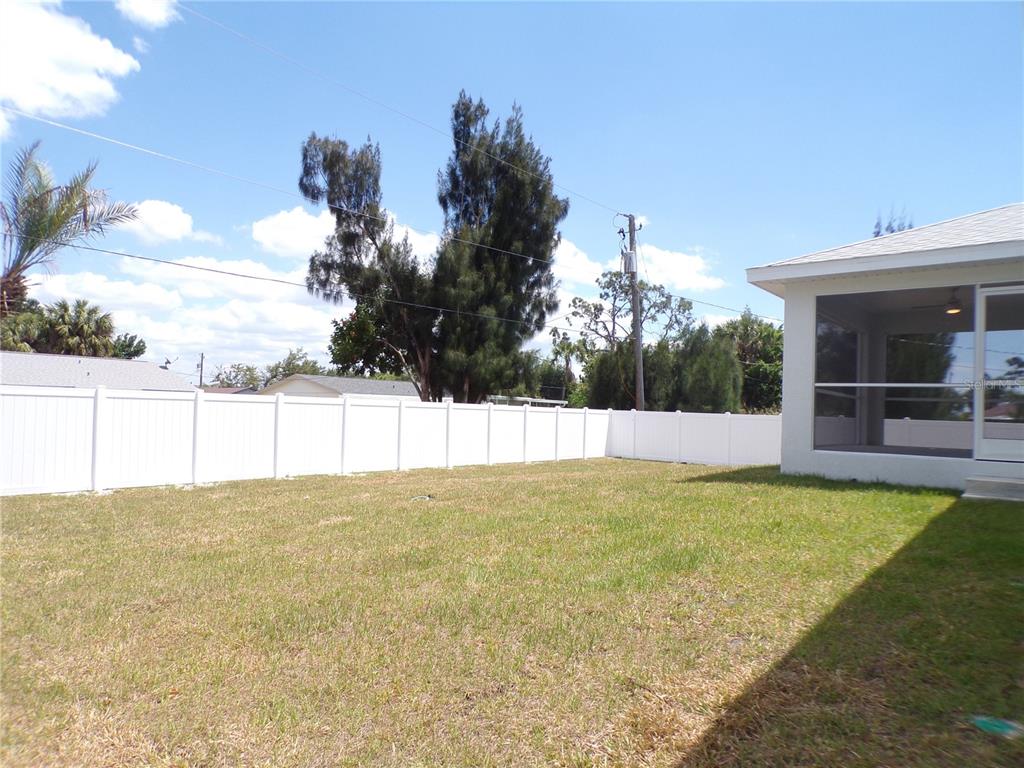 3112 Pinetree Street Port Charlotte, FL 33952 - Photo 22 of 35 a view of an outdoor space and swimming pool