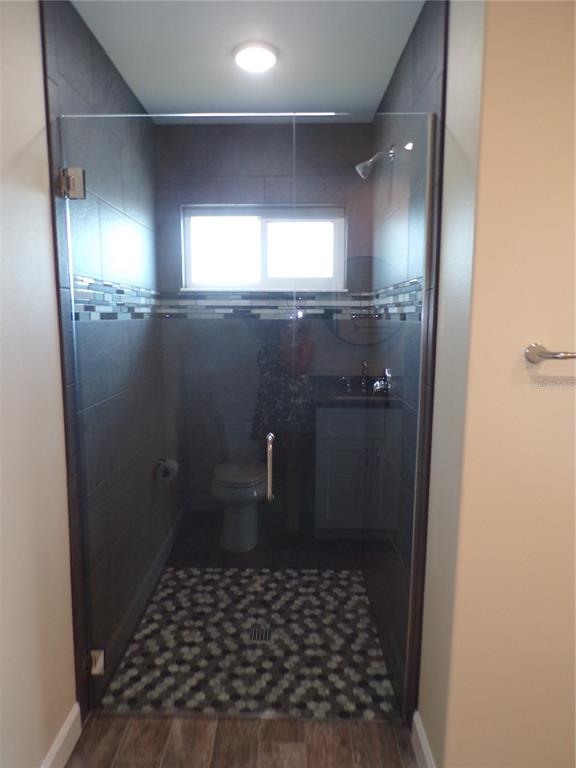 3112 Pinetree Street Port Charlotte, FL 33952 - Photo 26 of 35 a bathroom with a sink and a toilet