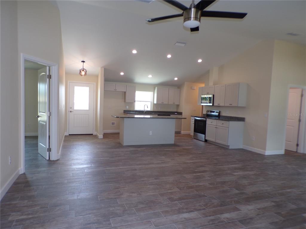 3112 Pinetree Street Port Charlotte, FL 33952 - Photo 3 of 35 a view of kitchen with stainless steel appliances refrigerator oven and cabinets