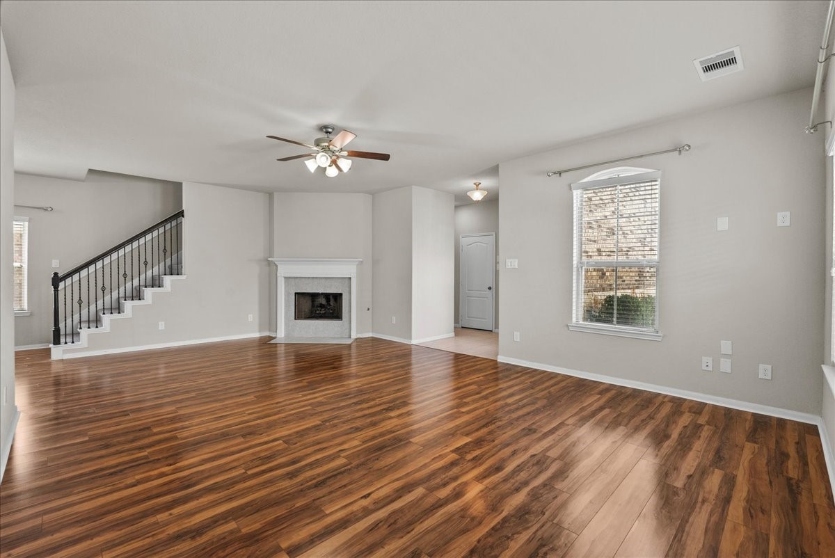 5111 Bay Lane Bacliff, TX 77518 - Photo 7 of 48 a view of an empty room with wooden floor and a window