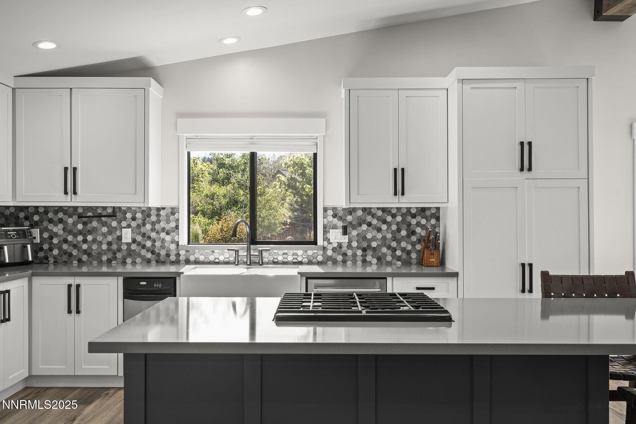 2505 Trails End Lane Reno, NV 89511 - Photo 11 of 45 a kitchen with granite countertop a sink and a stove