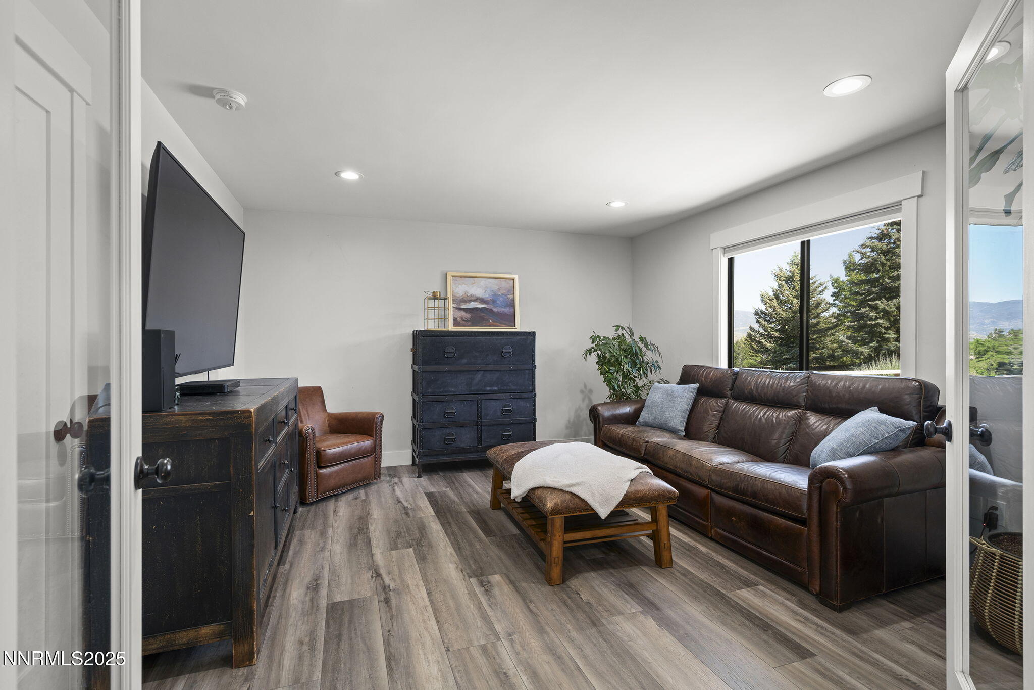 2505 Trails End Lane Reno, NV 89511 - Photo 14 of 45 a living room with furniture and a wooden floor