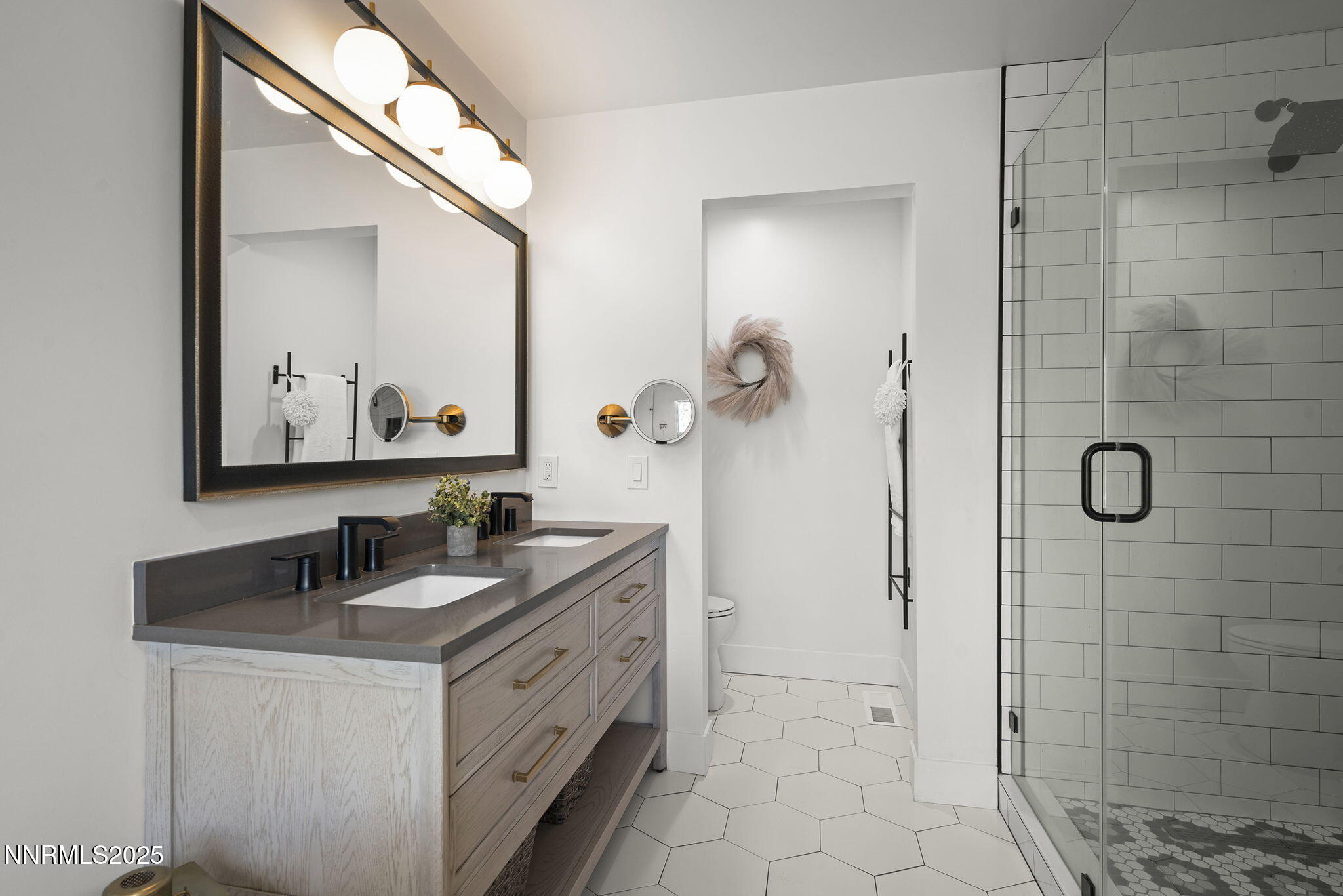 2505 Trails End Lane Reno, NV 89511 - Photo 17 of 45 a bathroom with a double vanity sink mirror and shower