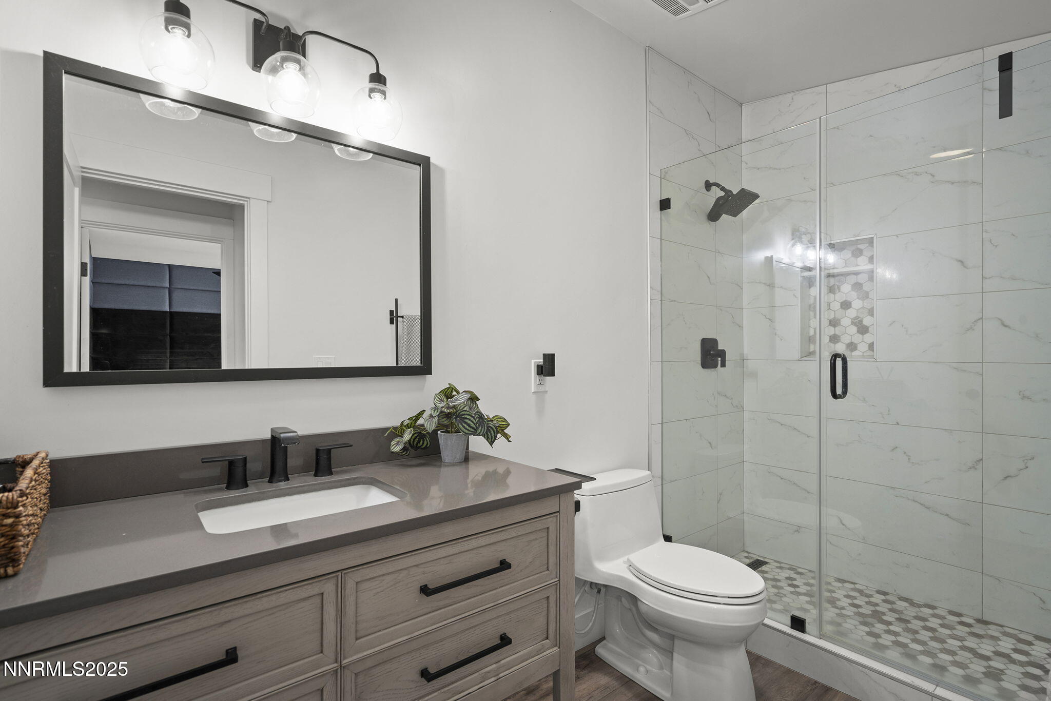 2505 Trails End Lane Reno, NV 89511 - Photo 19 of 45 a bathroom with a granite countertop sink toilet and shower