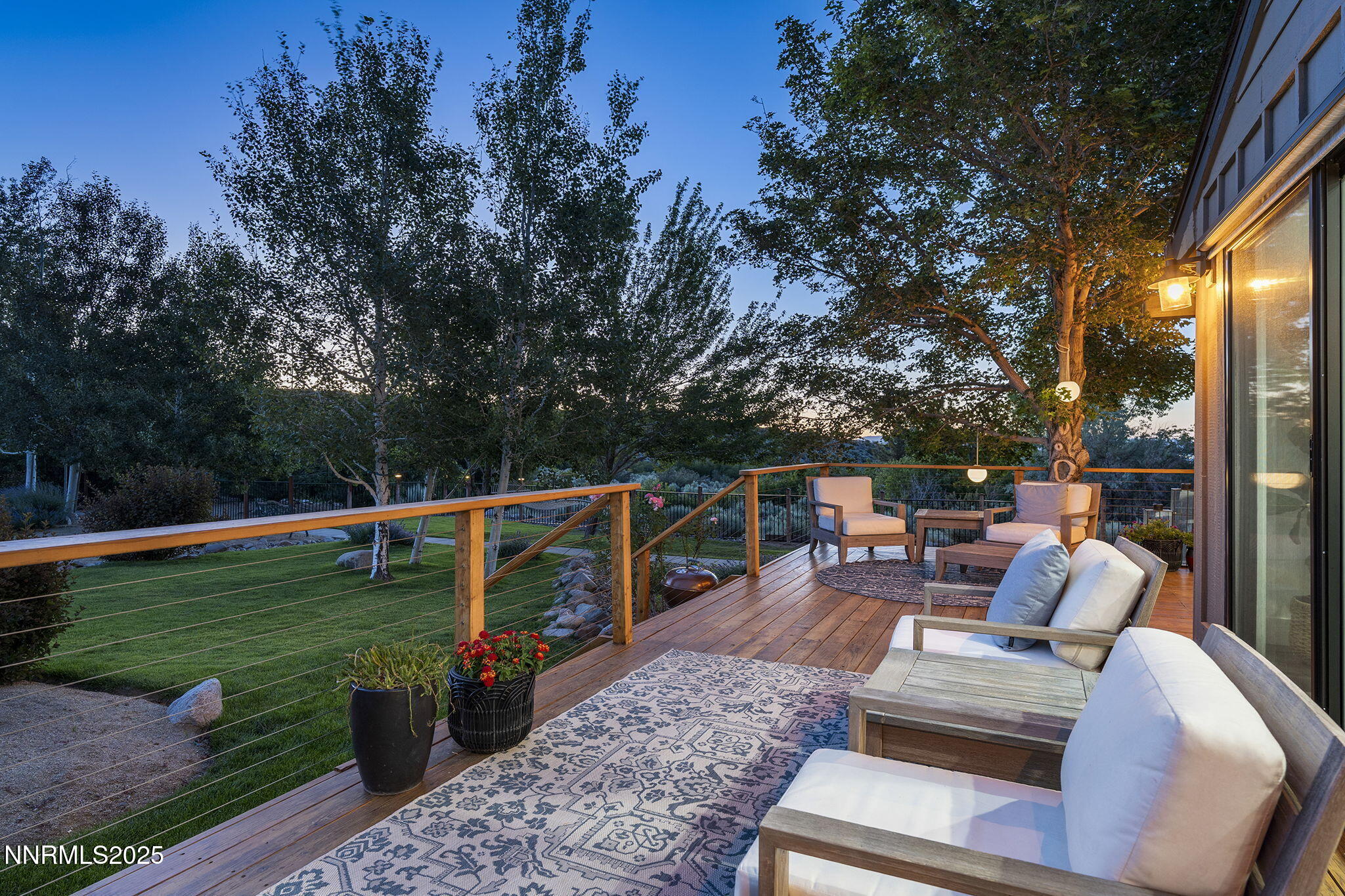 2505 Trails End Lane Reno, NV 89511 - Photo 31 of 45 a view of a deck with chairs a barbeque grill with wooden fence