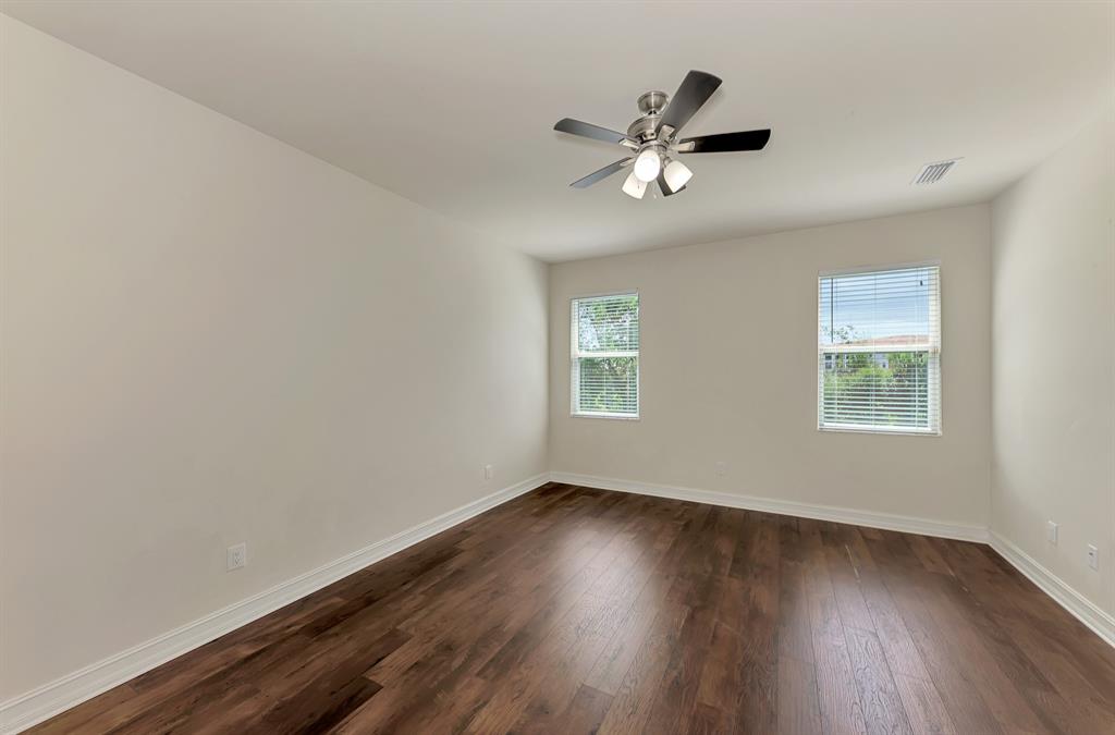 4429 Conchfish Lane Osprey, FL 34229 - Photo 19 of 39 a view of empty room with wooden floor and fan