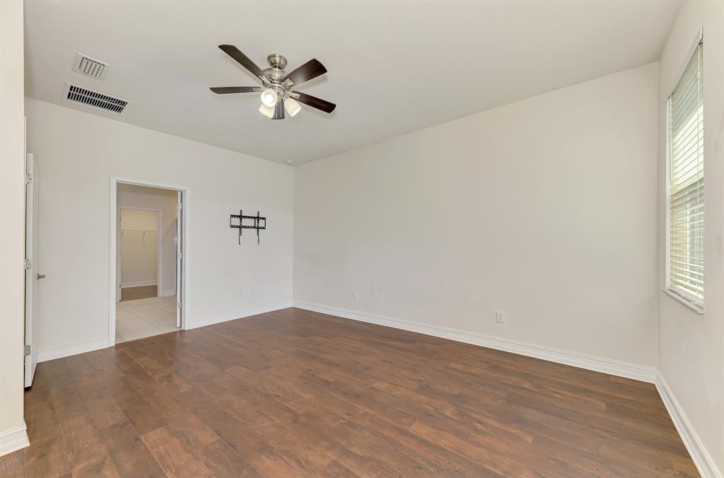 4429 Conchfish Lane Osprey, FL 34229 - Photo 22 of 39 a view of empty room with wooden floor and ceiling fan