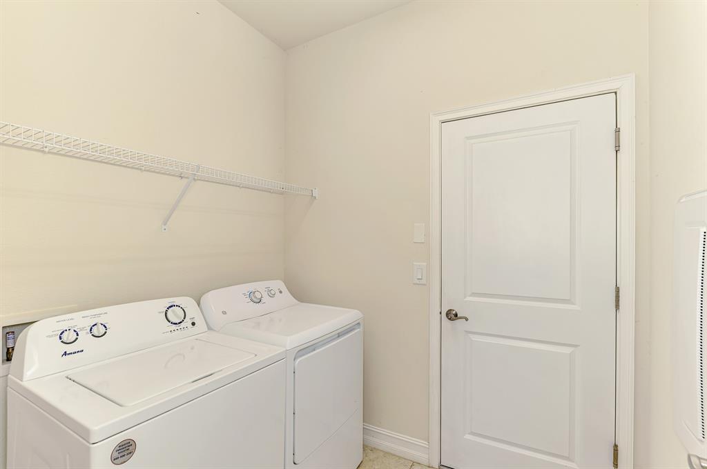 4429 Conchfish Lane Osprey, FL 34229 - Photo 32 of 39 a utility room with dryer and washer