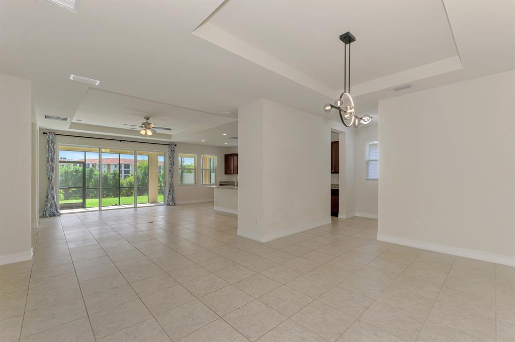 4429 Conchfish Lane Osprey, FL 34229 - Photo 6 of 39 a view of empty room with floor to ceiling window and ceiling fan