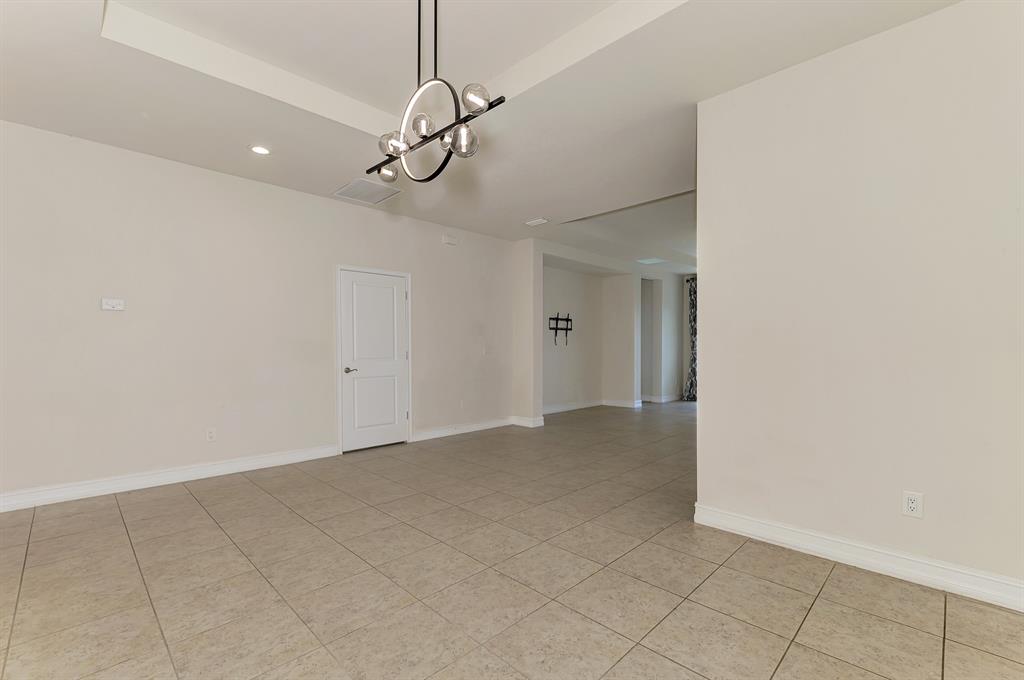 4429 Conchfish Lane Osprey, FL 34229 - Photo 8 of 39 a view of an empty room with a chandelier fan