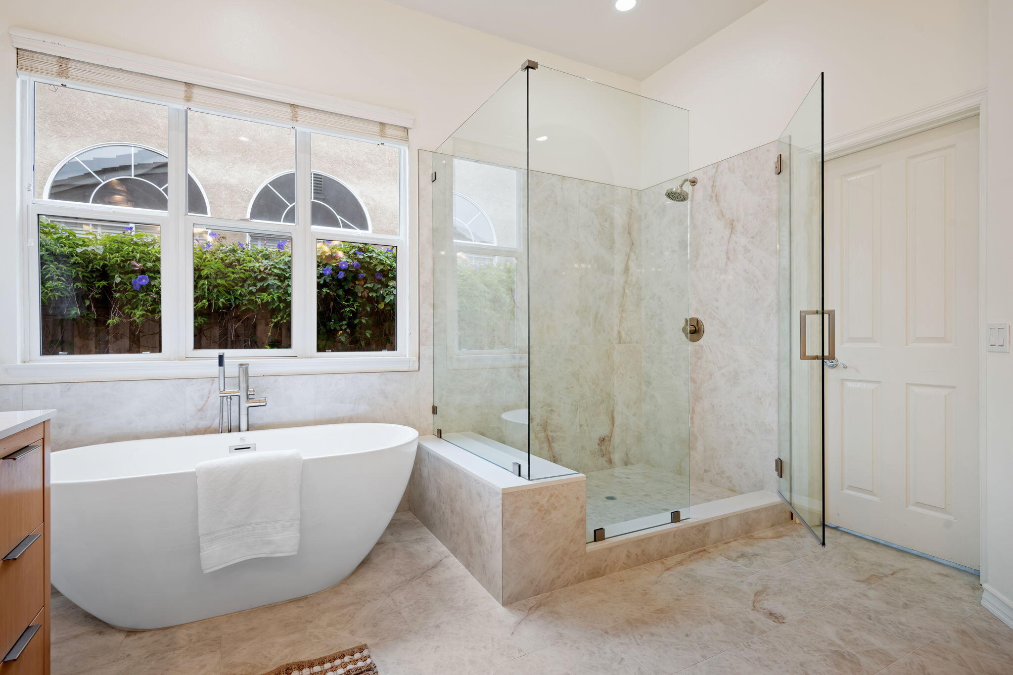 252 King Daniel Lane Goleta, CA 93117 - Photo 24 of 42 a spacious bathroom with a bathtub and a large window