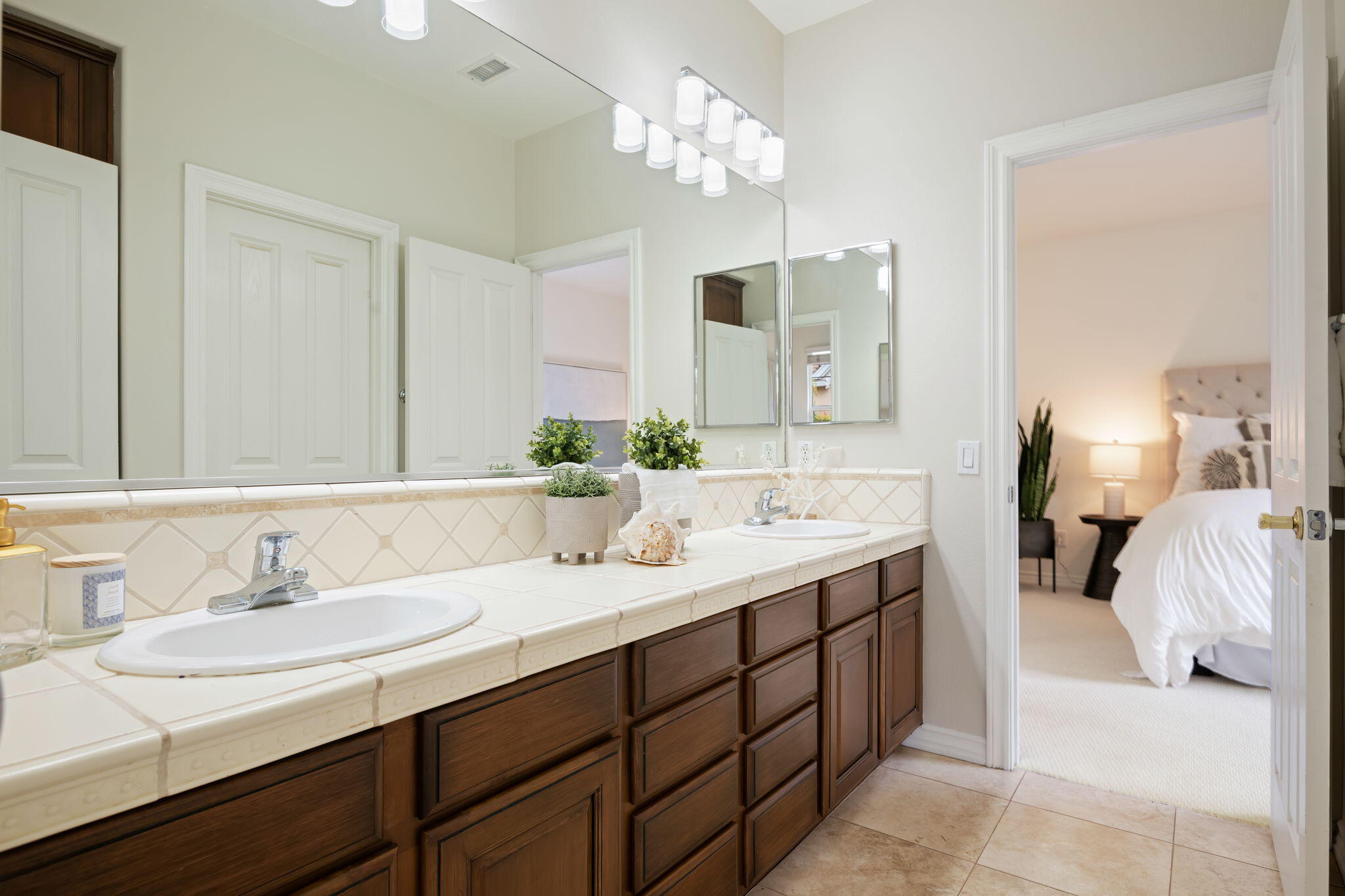252 King Daniel Lane Goleta, CA 93117 - Photo 29 of 42 a en suite bathroom with a double vanity sink mirror and