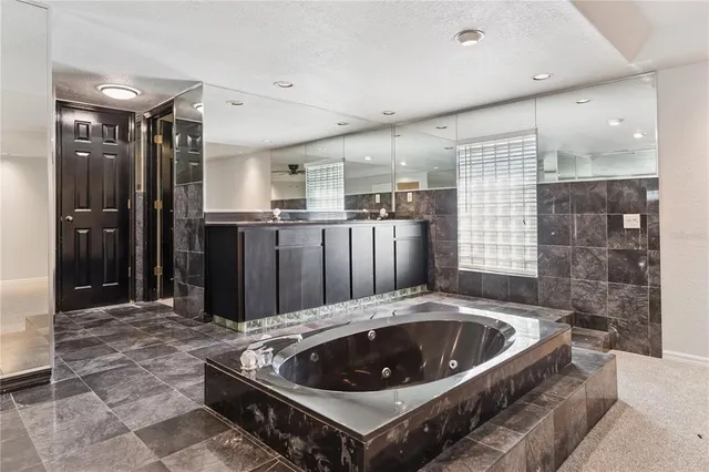 a kitchen with a stove a faucet and a refrigerator
