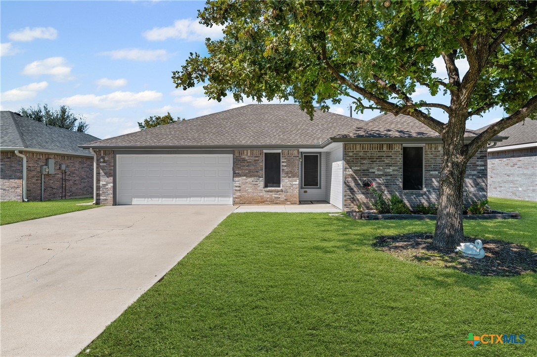 6525 Brooks Drive Temple, TX 76502 - Photo 1 of 37 a front view of a house with a garden and yard