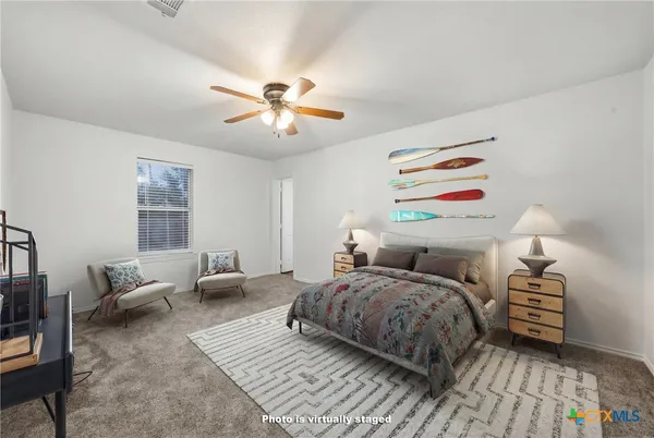 a bedroom with a bed furniture and a window