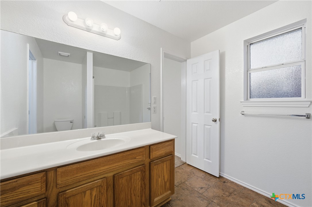 6525 Brooks Drive Temple, TX 76502 - Photo 23 of 37 a bathroom with a sink and a mirror